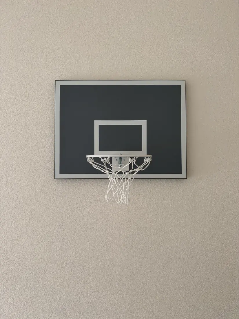 Mini basketball hoop mounted on the wall in Newport Beach, October 2026