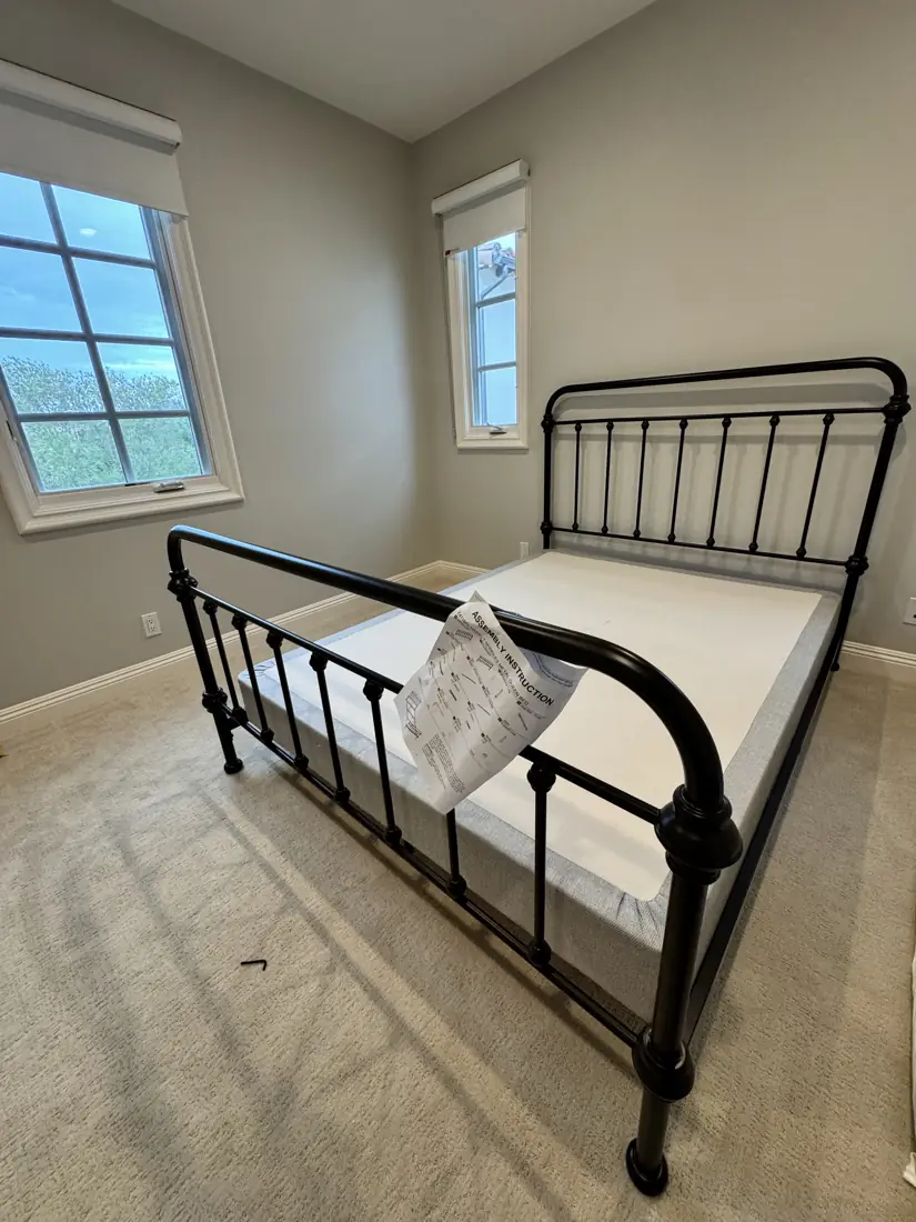 Black metal queen bed frame assembled in Orange County