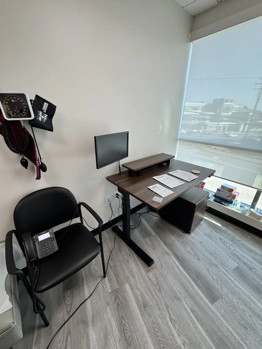Adjustable office desk and monitor setup assembled in Orange County