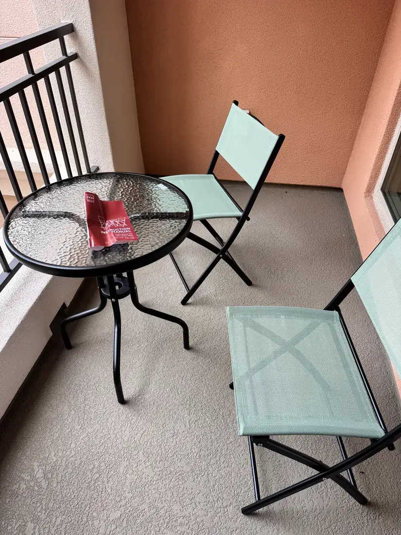 Glass-top patio bistro set assembled in Irvine, October 2026