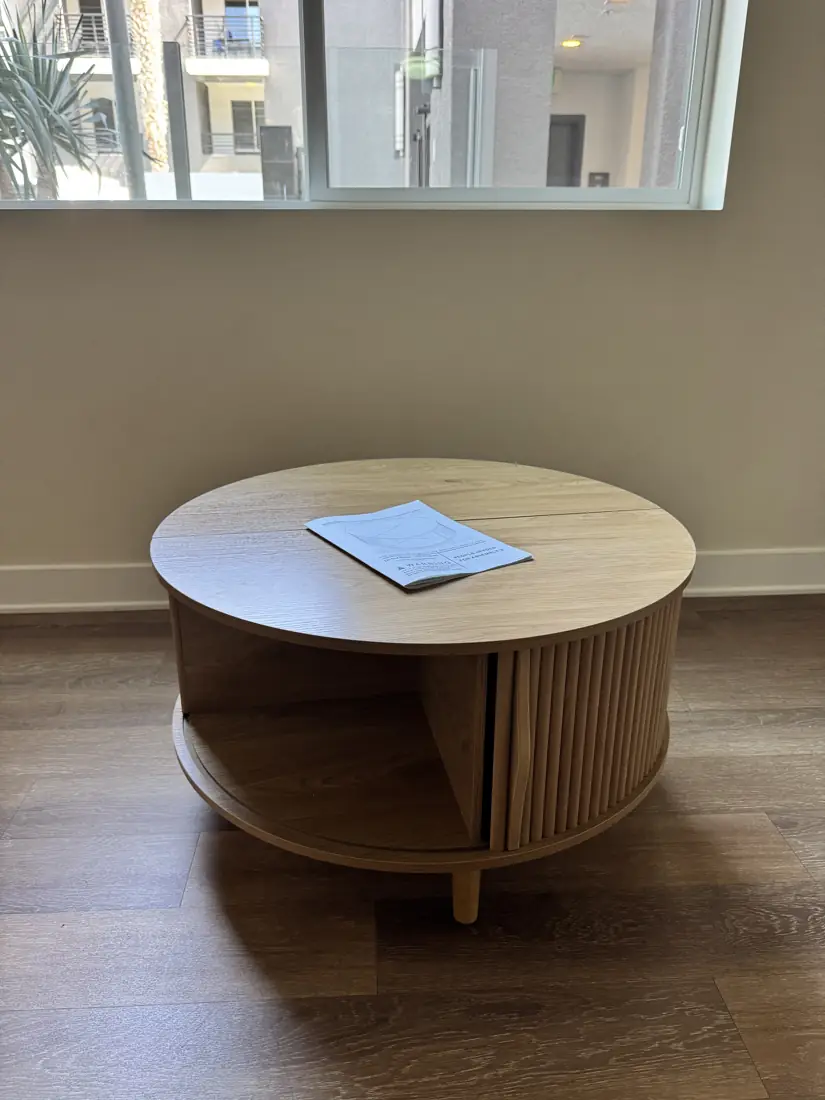 Round tambour-door coffee table assembled in Orange County